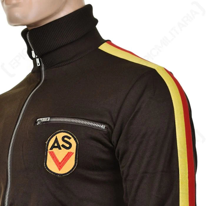 Close-up of the East German ASV sports jacket showing the ribbed stand-up collar and embroidered ASV shield patch