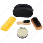 Contents of clear shoe polish set laid out including applicator brush, buffing brush, cloth, and neutral polish tin