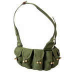 Side view of the olive SKS chest rig showing the pouch alignment and tie-back strap