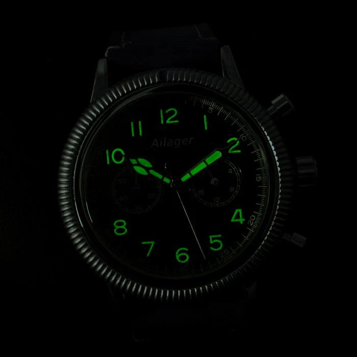 Luminous night glow demonstration of green dial numerals and cathedral hands in darkness