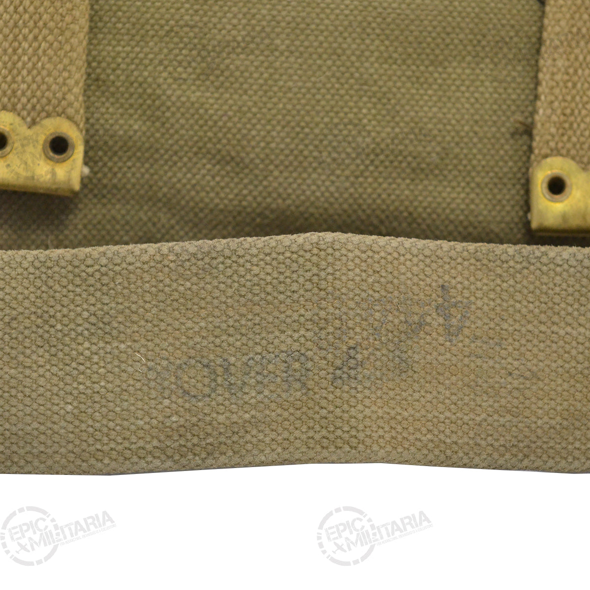 Close-up detail of the durable olive-drab canvas material and vintage brass fittings on the Greek Army small pack shoulder strap.