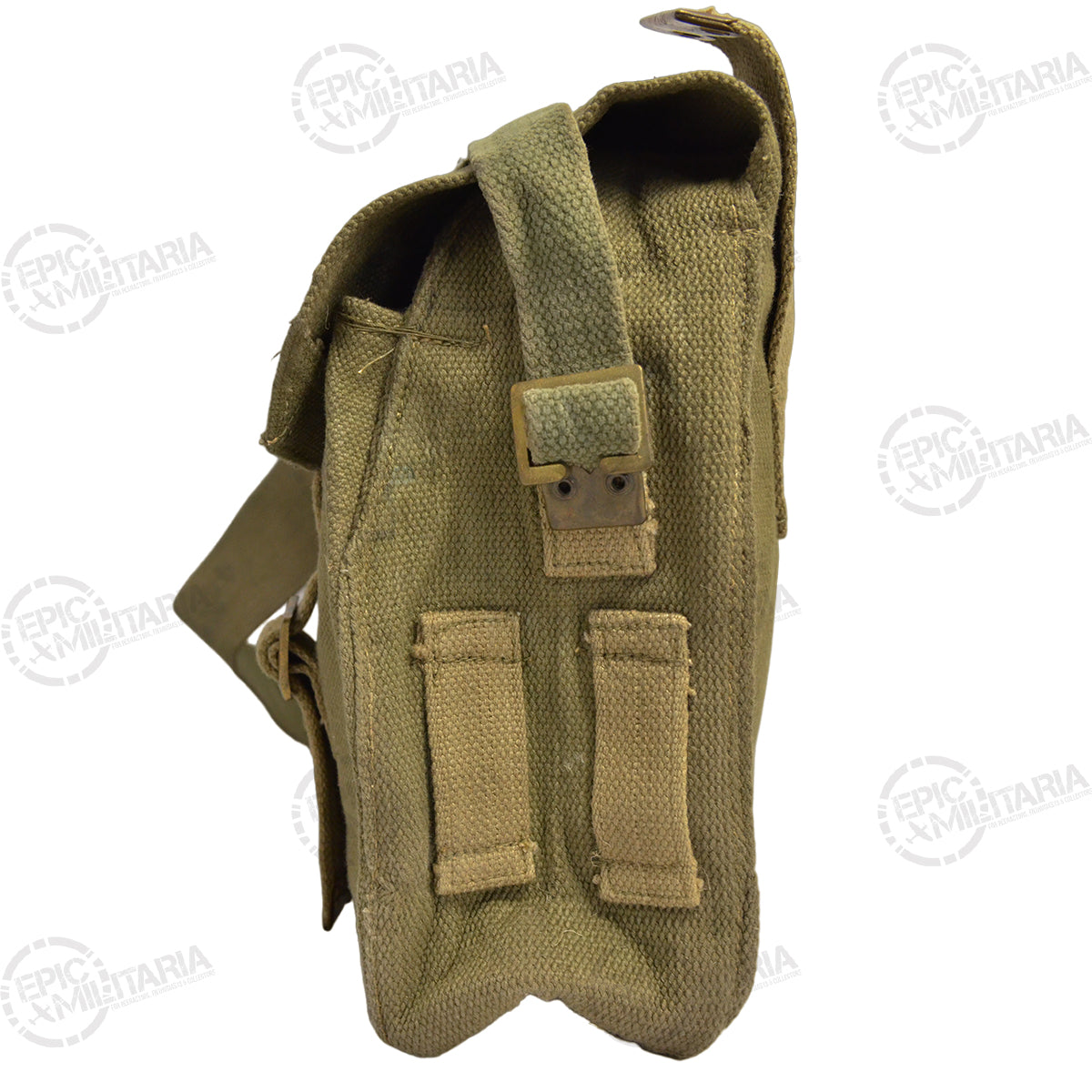 Side profile of the vintage Greek Army military pack showcasing its canvas construction, brass side adjustments, and attachment loops.