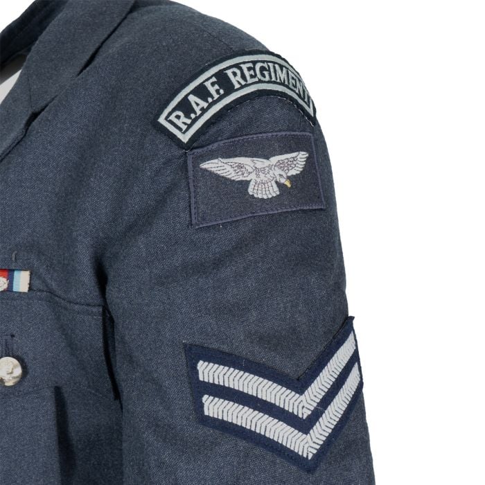 Detailed shot of RAF Regiment title flash and eagle insignia on dress jacket sleeve
