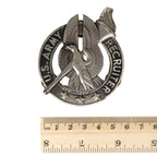 Front of US Army Recruiter Badge next to wooden ruler showing dimensions of 5.4 cm