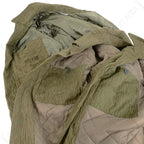 Interior view of East German Strichtarn winter jacket showing quilted insulation lining and NVA ink stamp
