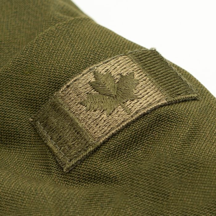 Close-up of the subdued olive embroidered Canadian maple leaf flag patch on the right sleeve of the jacket.