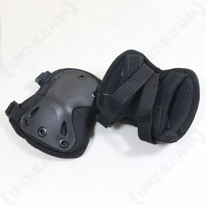 Rear view showing elastic hook and loop straps on black elbow pads