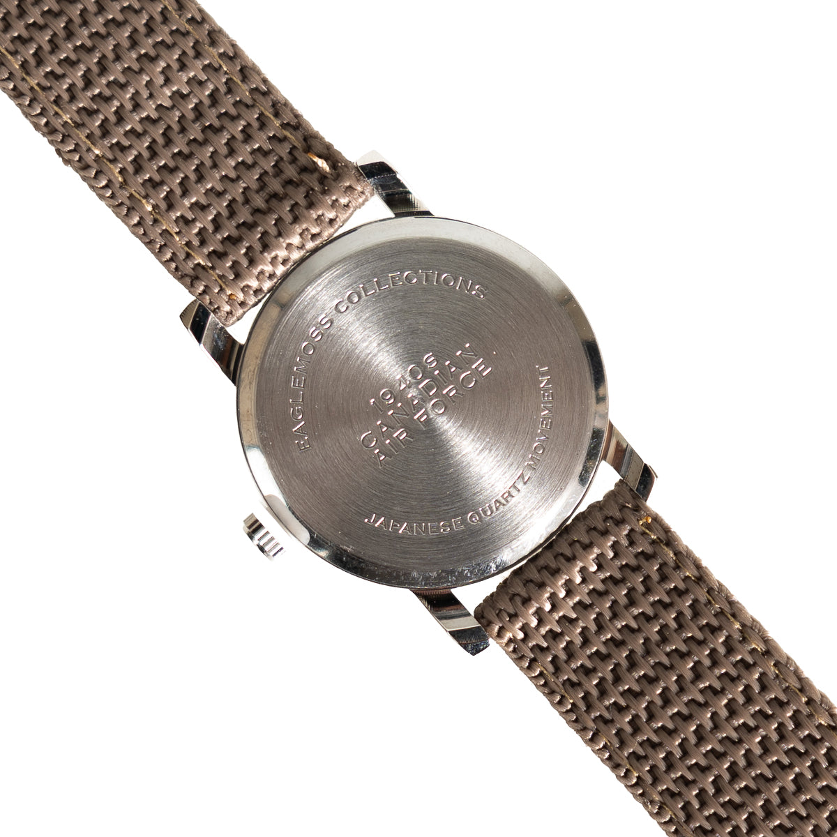 Stainless steel case back of the Eaglemoss Canadian pilot watch, stamped with 1940s Canadian Air Force branding and quartz movement details.