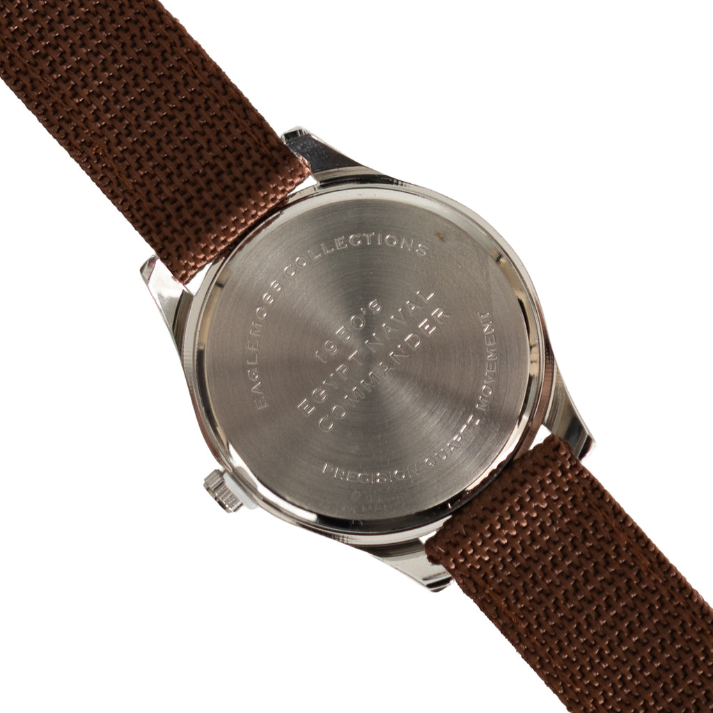 Close-up of the stainless steel case back on the Eaglemoss 1950s Egyptian Naval Commander watch, showing engraved military heritage details.