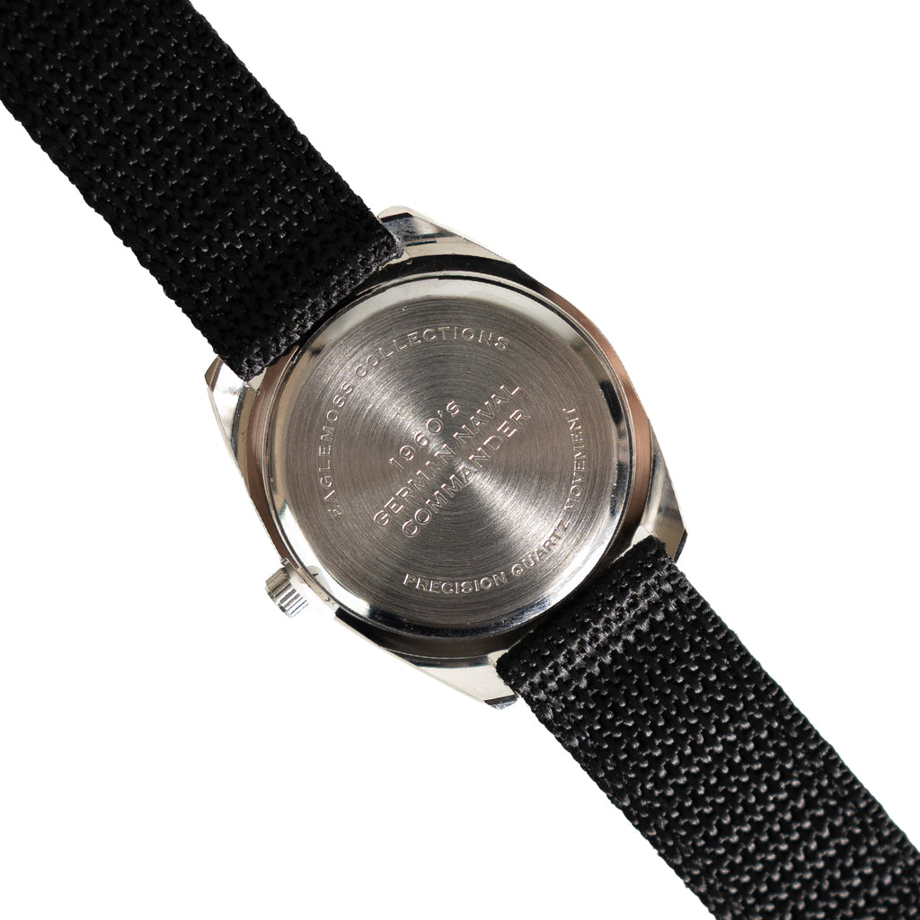 Stainless steel case back of the 1960s German Naval Commando style watch featuring engraved Eaglemoss Military Watches branding.