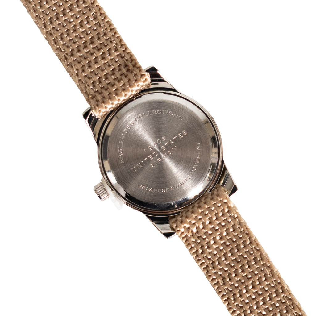 Close-up of the stainless steel case back of the 1940s US Airman watch, featuring Japanese quartz movement engraving and serial details.