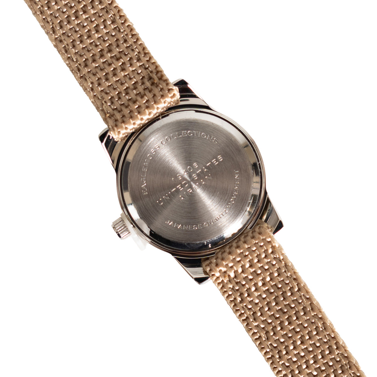 Close-up of the stainless steel case back of the 1940s US Airman watch, featuring Japanese quartz movement engraving and serial details.