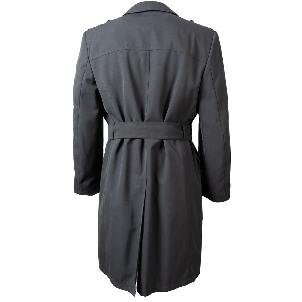 Rear view of the authentic German Army surplus trench coat showing the longline cut and classic military tailoring.