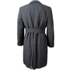 Rear view of the authentic German Army surplus trench coat showing the longline cut and classic military tailoring.