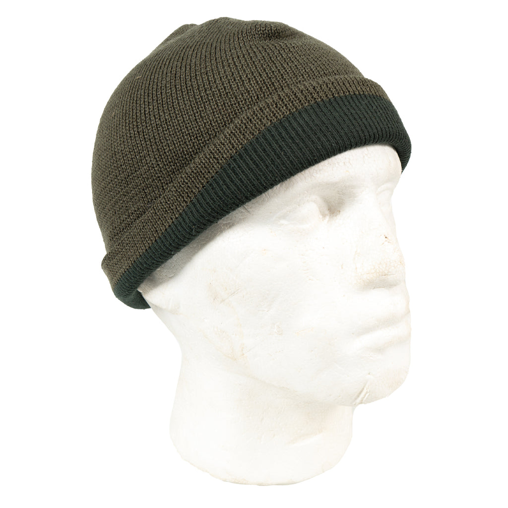 Side profile of an Austrian Bundesheer beanie on a mannequin, demonstrating the adjustable, packable design and dual-layer knit texture.