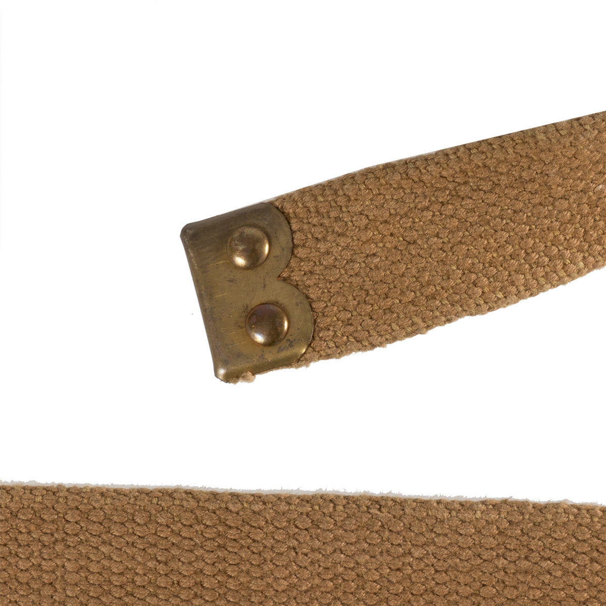 Brass metal end piece on a vintage British Army 37 pattern webbing strap, showing authentic WW2 surplus metal hardware.