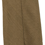 Macro close-up of the vintage khaki rayon fabric on a British WW2 army tie, revealing the subtle diamond-like texture and weave.