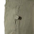 Detailed side view of an olive NVA combat trouser pocket, showing the sturdy button fastening used for secure gear storage.