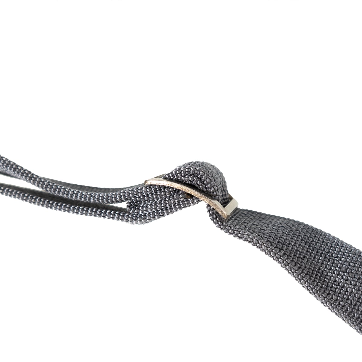 Detail of the adjustable metal sliding buckle on the heavy-duty Cold War era East German military utility sling.