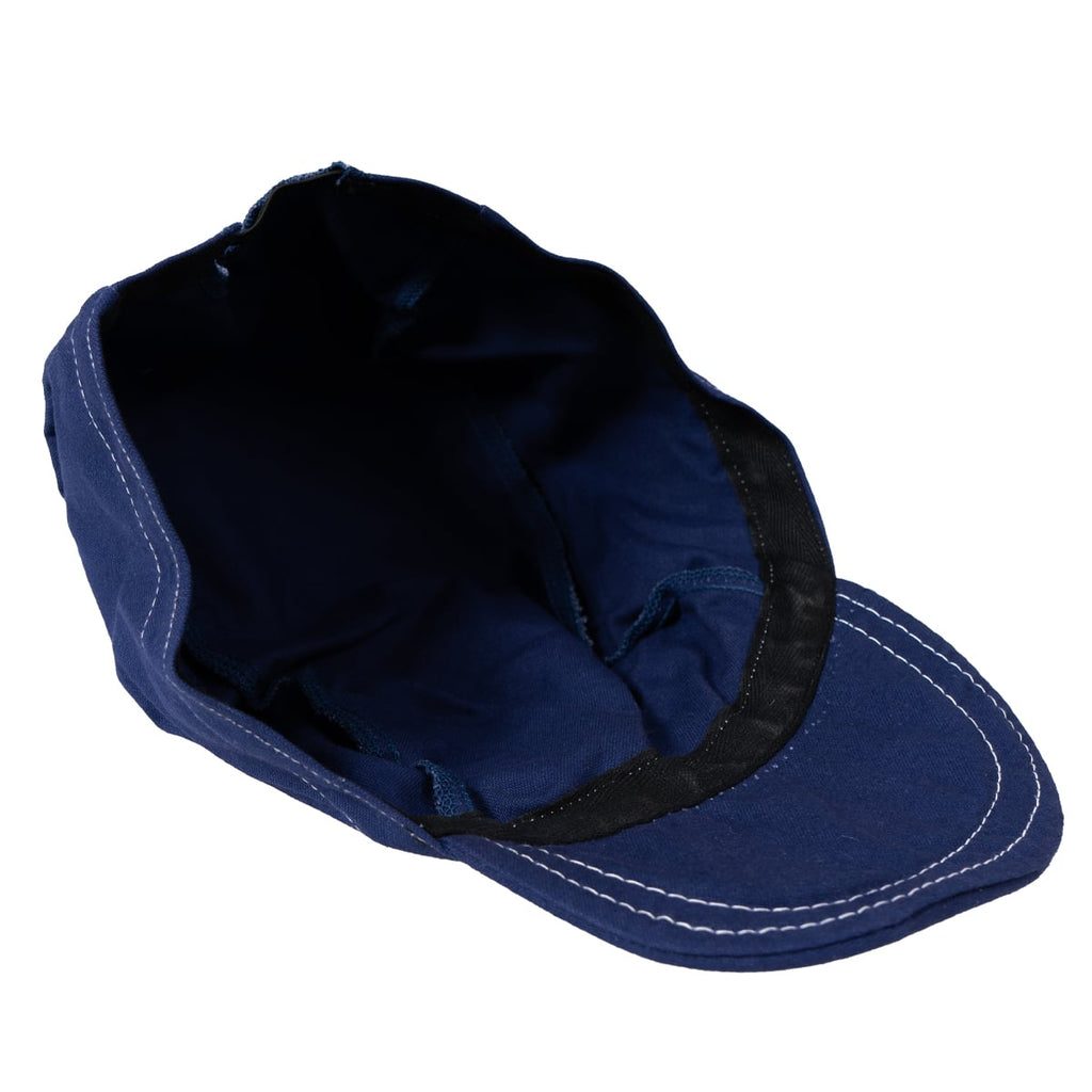 Internal view of the blue NVA workers cap, showing the construction, reinforced peak, and black sweatband lining.