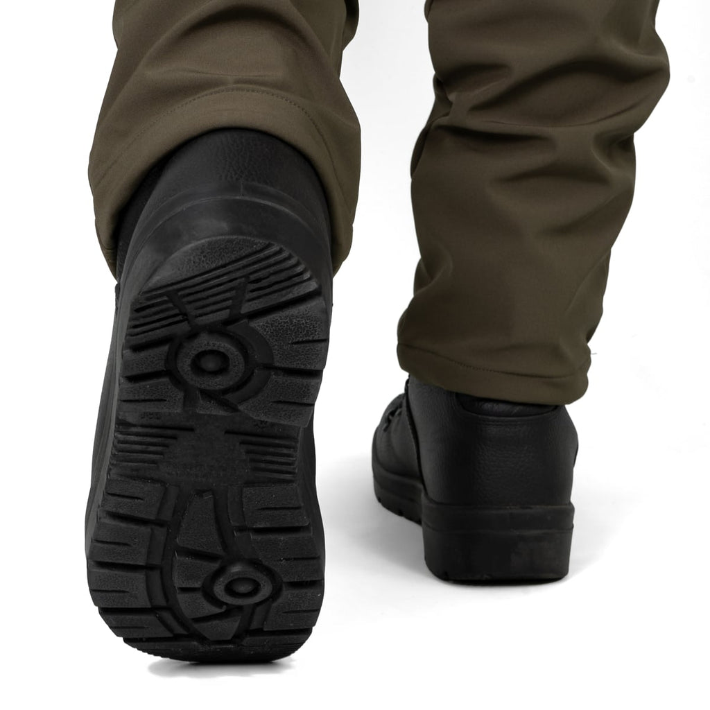 Rear angle view showing the heavy-duty tread of the German Army KS2005 boots while being worn.