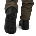 Rear angle view showing the heavy-duty tread of the German Army KS2005 boots while being worn.