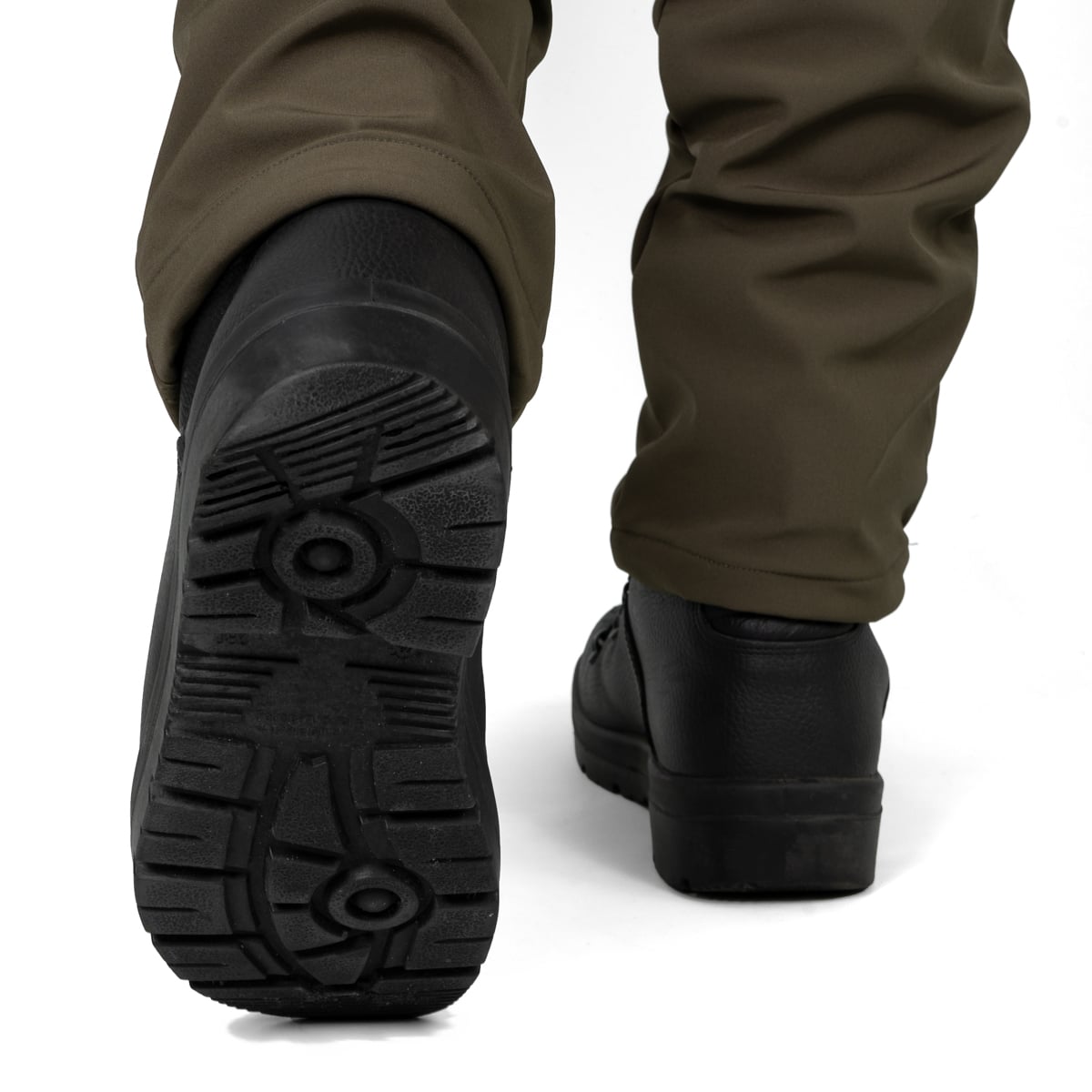 Rear angle view showing the heavy-duty tread of the German Army KS2005 boots while being worn.