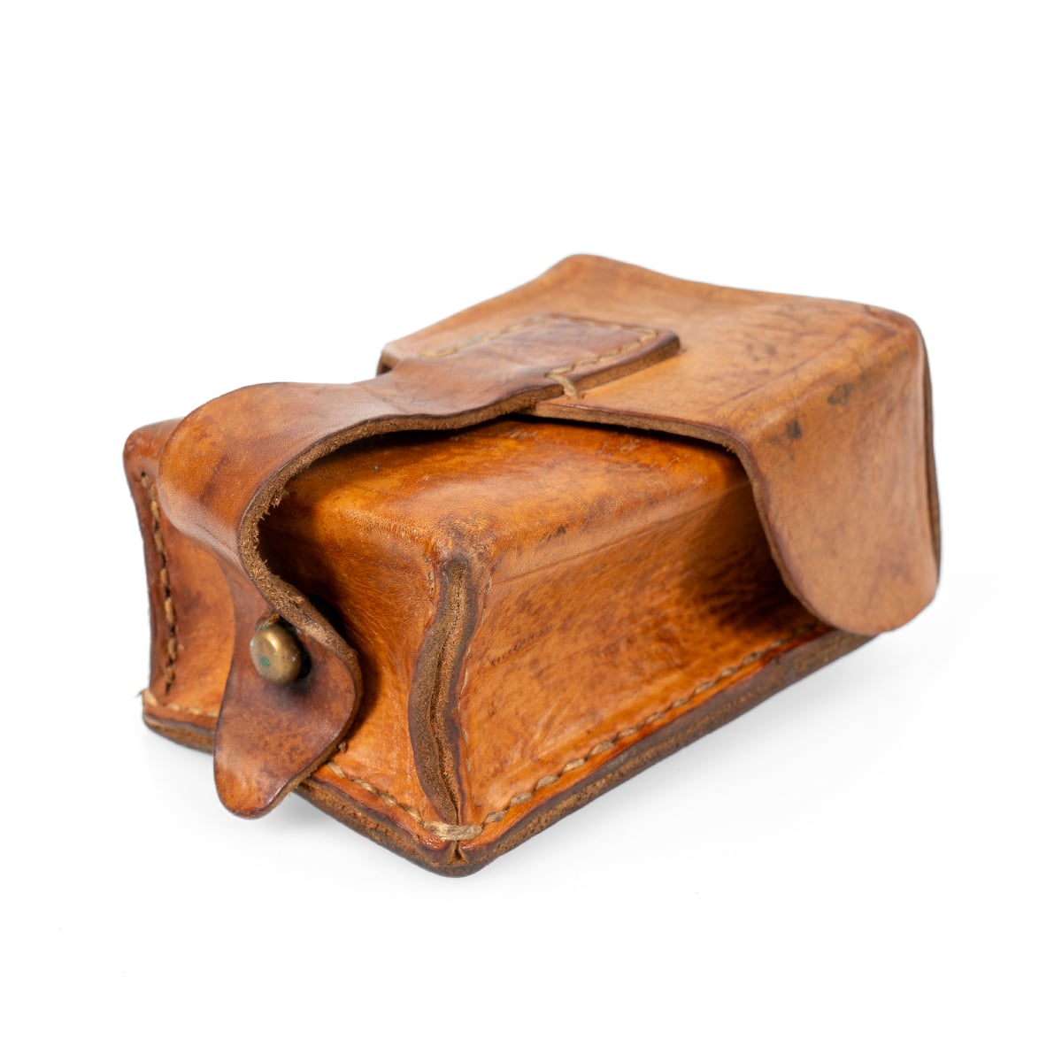 Angled perspective of the Serbian Army leather mag pouch highlighting the brass ball lid closure mechanism and rigid design.