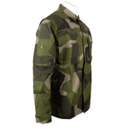 Three-quarter view of the genuine Swedish Army M90 shirt displaying the button and hook-and-loop front closure system.