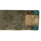 Textured rectangular mat with a mix of brown, beige, and green colors on a white background