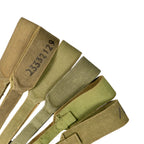 Varied collection of khaki 37 Pattern webbing straps, showcasing different canvas textures and wear levels.