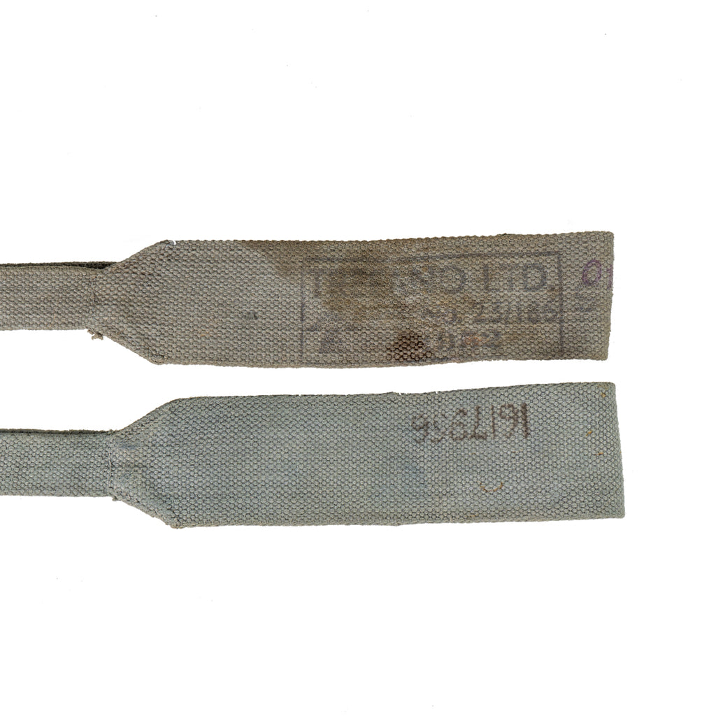 Macro view of grey 37 Pattern straps highlighting original military stampings on the cotton canvas.