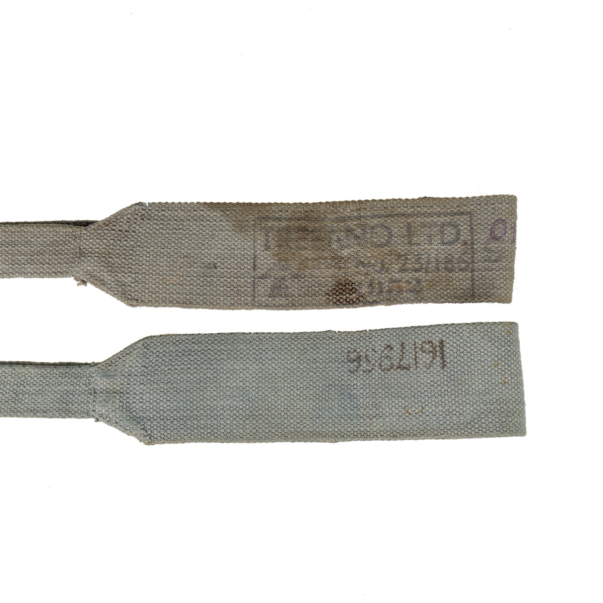 Macro view of grey 37 Pattern straps highlighting original military stampings on the cotton canvas.