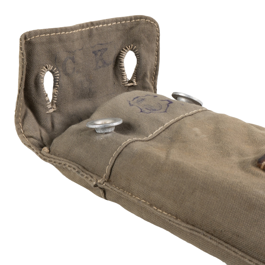 Top opening of the vintage canvas carrying pack, revealing the internal structure and authentic stamps for the Swiss Army Zeltbahn pole kit.
