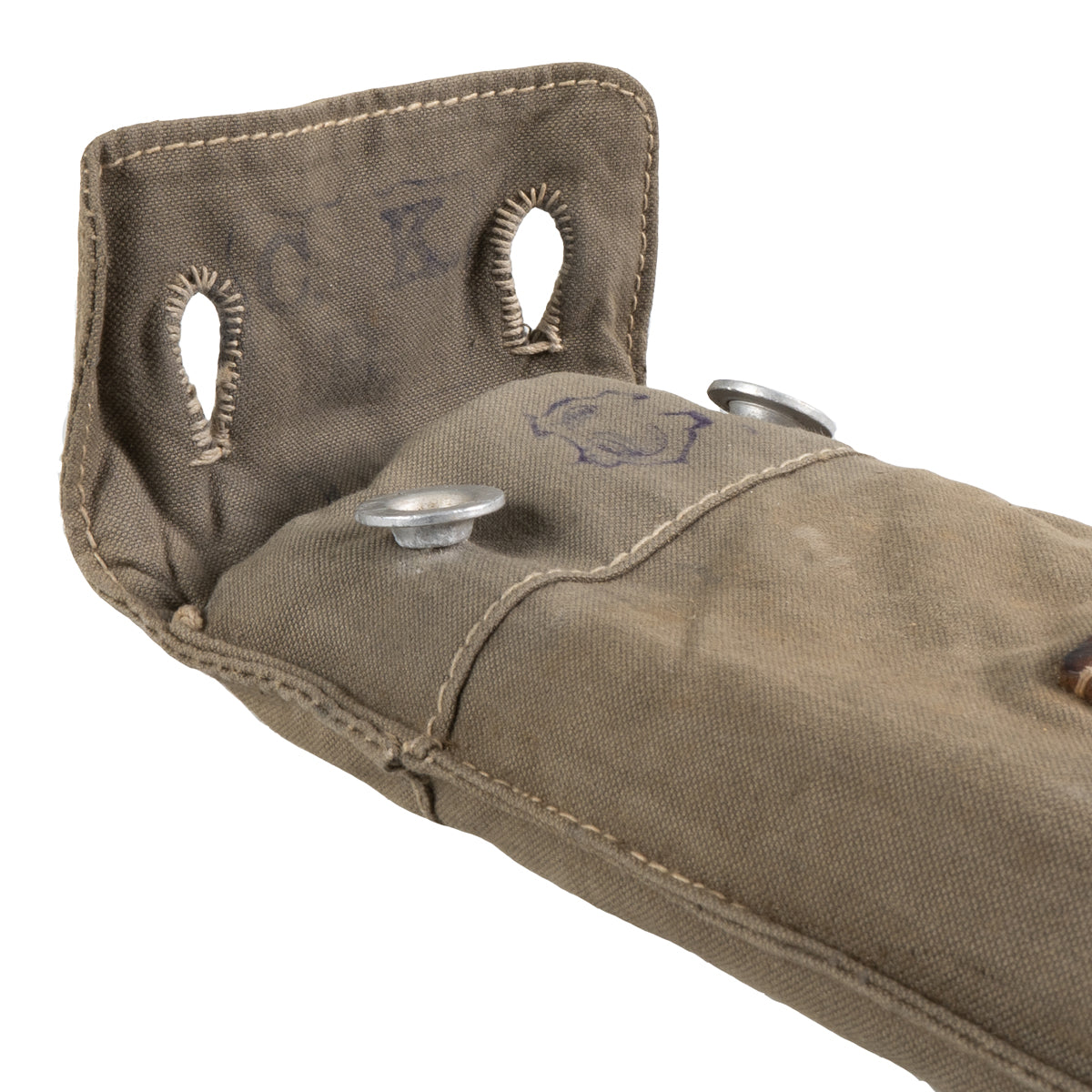 Top opening of the vintage canvas carrying pack, revealing the internal structure and authentic stamps for the Swiss Army Zeltbahn pole kit.