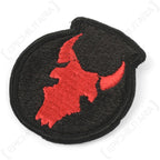 Detailed side view of embroidered red bull skull on original US 34th Infantry Division patch