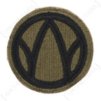Front view of original US 89th Infantry Division shoulder patch featuring black Rolling W emblem on olive green background