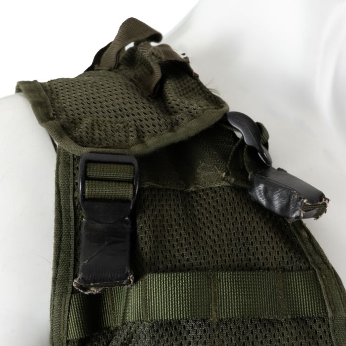 Detailed view of the padded adjustable shoulder strap buckle on the mesh backing