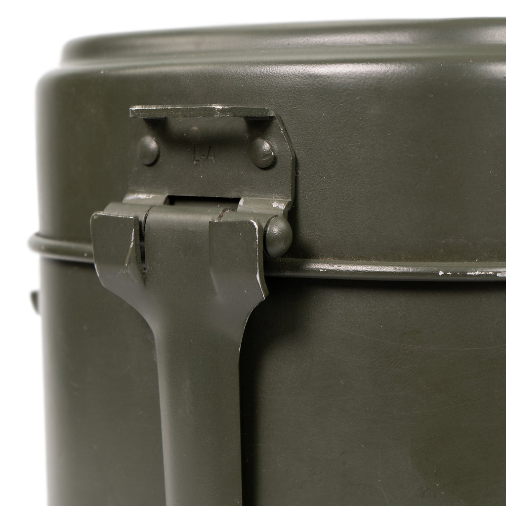 Close-up detail of the metal latch mechanism and folding handle on the genuine Austrian military surplus mess tin set.