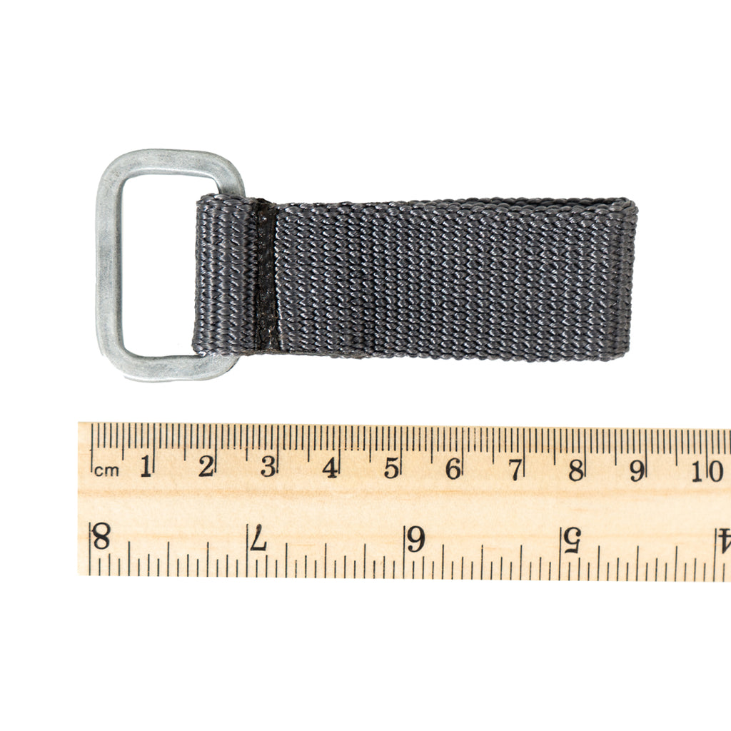 East German military belt loop next to a metric ruler, showing approximately 8 centimeters of total length for scale.