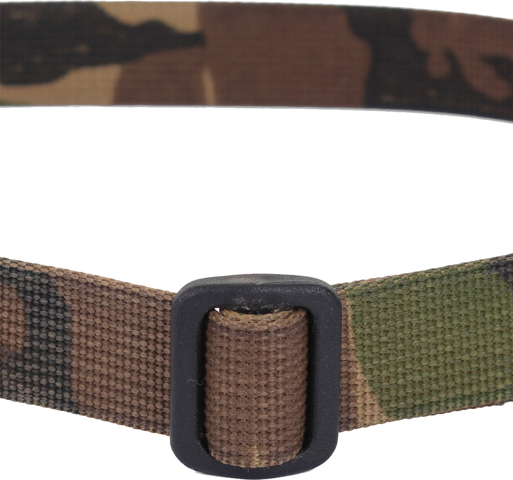 Detailed close-up of the rear side of the black plastic buckle on a genuine Dutch woodland camo webbing strap.