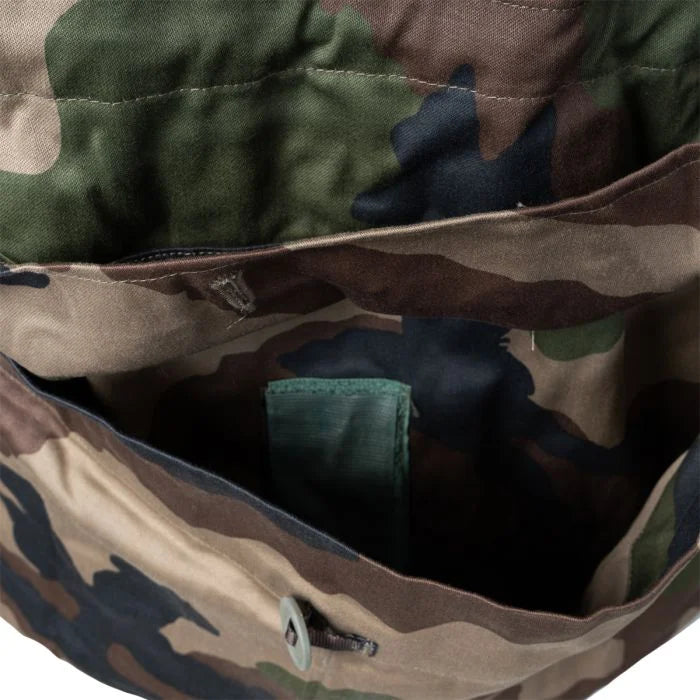 Detailed view of the buttoned flap on the dual-access rear lumbar poachers pocket