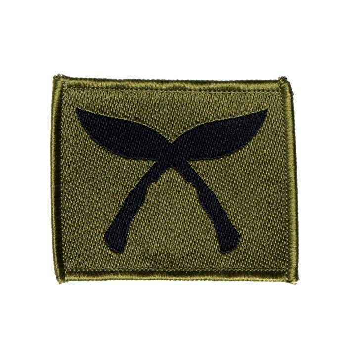 Front view of the British Army Gurkha Brigade Tactical Recognition Flash patch showing the subdued black crossed kukri embroidery on olive green.
