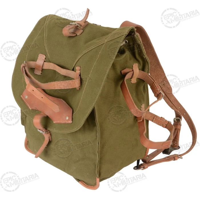 Side view of the Romanian Army canvas backpack showing the side pouch and leather utility straps