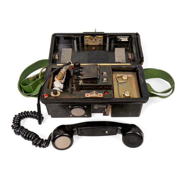 East German NVA Cold War field telephone open with handset and battery compartment