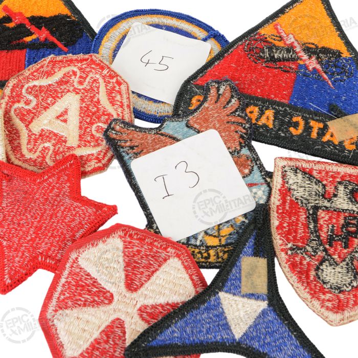 Close up reverse side detail of original post WW2 US military cut edge patches