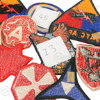 Close up reverse side detail of original post WW2 US military cut edge patches