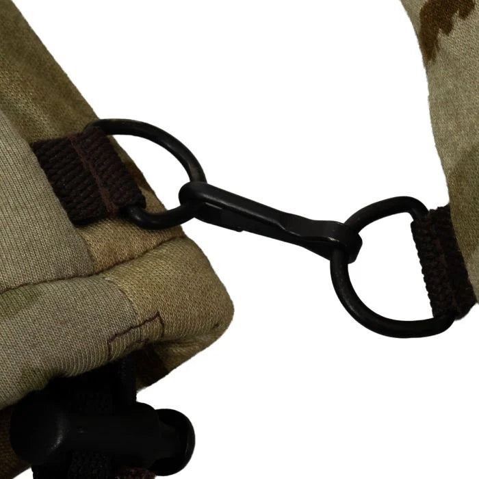 Close-up of the black plastic linking clip on the cuffs of the British Army MTP winter mittens.