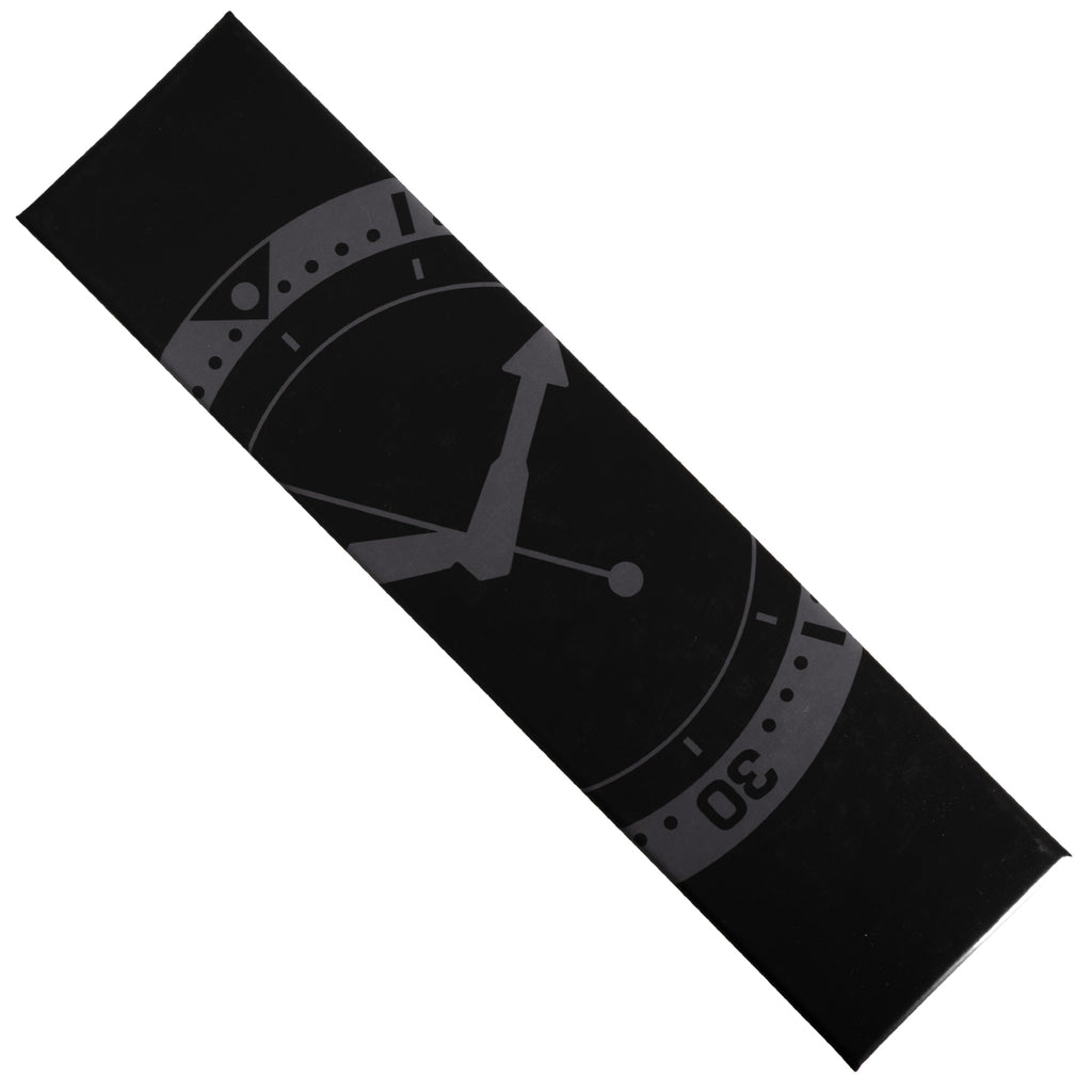 Close-up of the black watch presentation box sleeve featuring a stylized clock face design and text indicating issue 30.