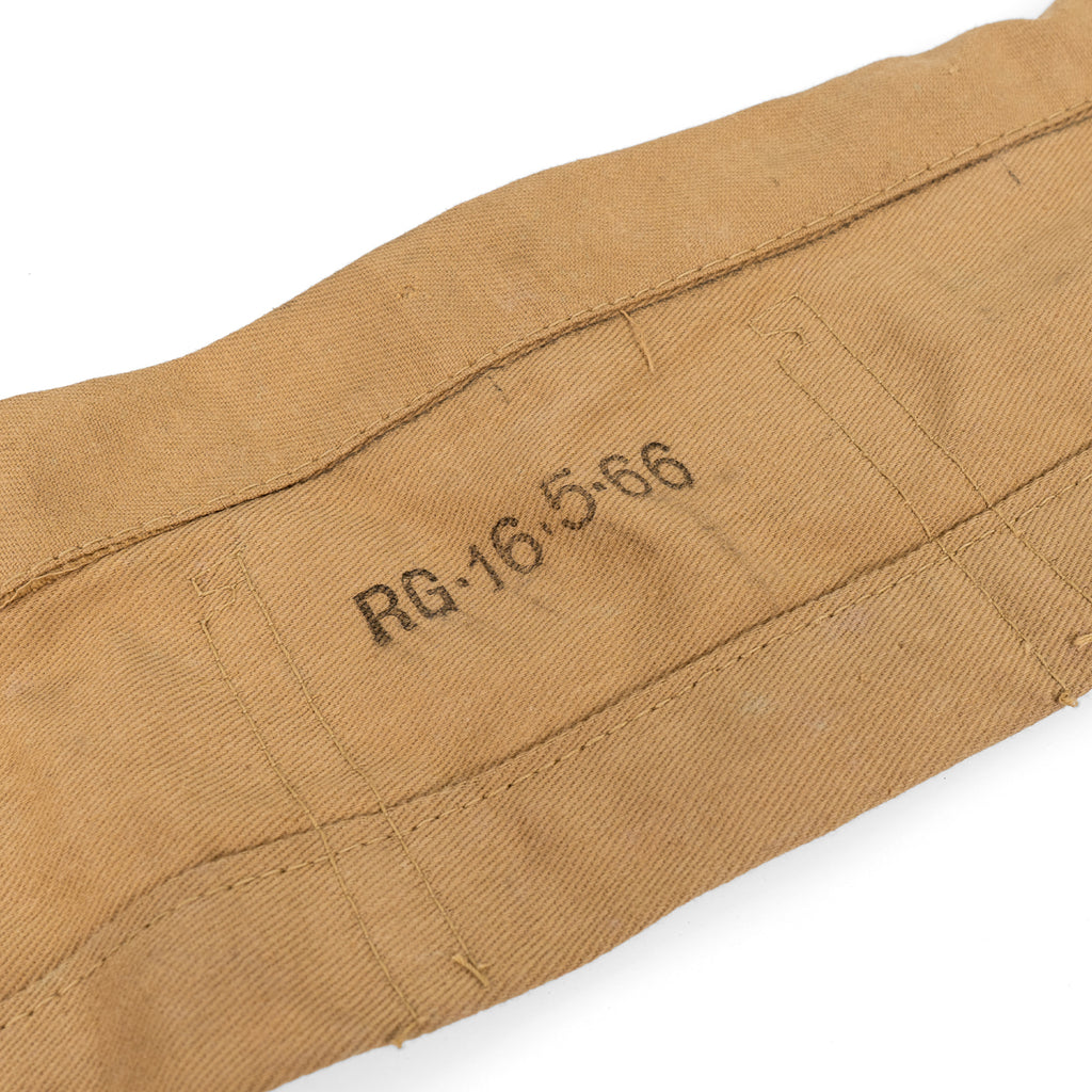 Detailed view of 1966 date stamp printed on the side of a vintage British Army Lee Enfield ammo bandolier.